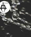 Adjustable Motorcycle Chain Tensioner Tool For Chain Maintenance In Beefy Steel With Easy To Use Design Tighten Remove And Cut Chains Fits A Variety Of Chain Sizes Available In Size S And Size L Industrial Grade shown with a motorcycle chain close-up