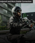 Motorcyclist wearing helmet with Motorcycle Helmet Bluetooth Headset with Waterproof Sports Sound System Hands Free Music.