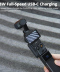 Power Bank Grip For Pocket 3 And Pocket 4 Camera With 5000 mAh Battery LED Display showing 18 Watt USB C Charging