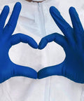 Front view: pair of cobalt blue nitrile medical-examination gloves forming a heart; latex-free
