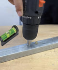 2Pack Magnetic Bubble Levels With Heavy Duty Iron Grip Solid Acrylic Spirit Level shown in use with a drill on metal.