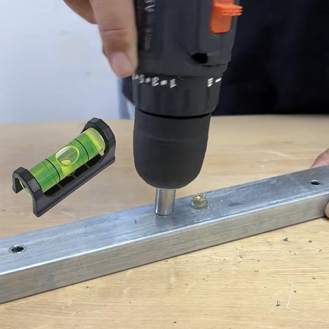 2Pack Magnetic Bubble Levels With Heavy Duty Iron Grip Solid Acrylic Spirit Level shown in use with a drill on metal.