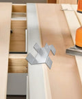 Four Piece No Drill Fence Brackets With Gravel Board Clips, Metal Anti Rattle Hardware for outdoor fences on a workbench