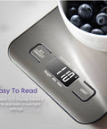 Ultra Accurate Kitchen Scale With 1g Precision For Cooking And Baking, stainless steel, showing LCD display with blueberries on top.