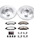 PowerStop front brake kit in front view with drilled/slotted rotors and carbon-ceramic pads.
