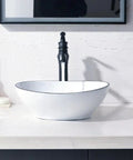 16 Inch Oval Bathroom Vessel Sink And Brushed Nickel Faucet Combo In White Ceramic Porcelain Above Counter Design With Pop Up Drain Vanity Sink Set For A Sleek Modern Bathroom Upgrade And Easy Install displayed in a modern bathroom setting.