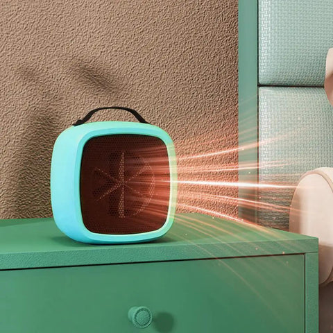 Tiny But Mighty Compact Ceramic Space Heater 500W in yellow on green desk with heat waves visible, for cozy warmth and safety.