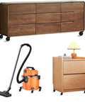 Wooden dresser and cabinet with antique brass caster wheels set of four with rubber wheels and five sixteenth inch by one and one half inch stem sockets for sofa chair cabinet or dresser vintage furniture with smooth quiet rolling and durable steel construction, alongside orange vacuum cleaner on casters.