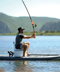 Person kayaking on a lake using Never Lose Your Fishing Rod Again With High Visibility Orange Floats For Kayaks And Boats.
