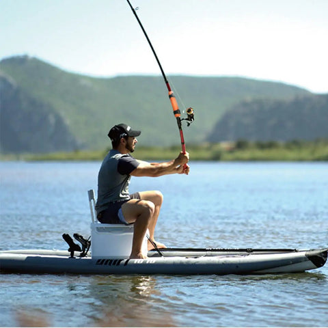 Person kayaking on a lake using Never Lose Your Fishing Rod Again With High Visibility Orange Floats For Kayaks And Boats.