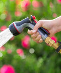 Heavy Duty Brass Garden Hose Shut Off Valve Set With 2 Valves And 4 Extra Washers Solid Brass One Way Connector in use spraying water