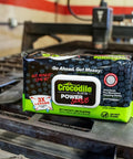 Package of PowerSCRUB Dual-Surface Cleaning Wipes Heavy-Duty Moist Cloths 80 Count in an industrial setting.
