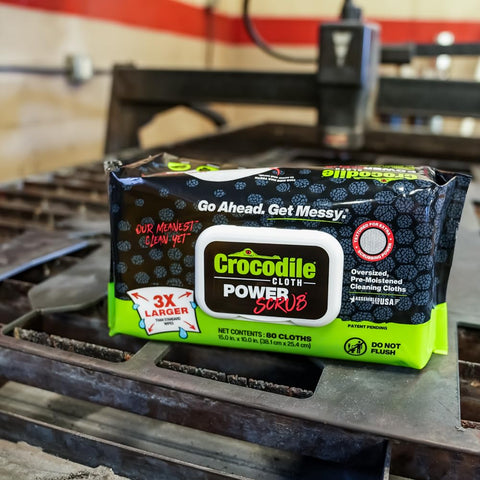 Package of PowerSCRUB Dual-Surface Cleaning Wipes Heavy-Duty Moist Cloths 80 Count in an industrial setting.