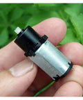 Planetary Gear Electronic Starter Motor, 420 RPM, 12mm Shaft, 5V/6V Compatible, held in hand showing size and details