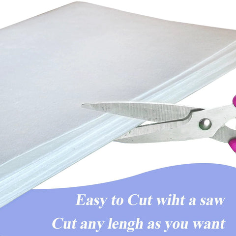 White ceramic fiber paper sheet for kiln insulation, 24 x 33 x 0.08 in, 3-pack, being cut with scissors.