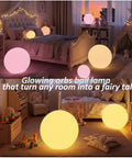 16 inch rechargeable LED globe light with remote in children's bedroom, two glowing RGB orbs on floor and bed, warm ambiance lighting