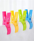 Colorful heavy duty beach towel clips for chairs and loungers securing towel, windproof clips to keep towels, swimsuits, and gear from blowing away.