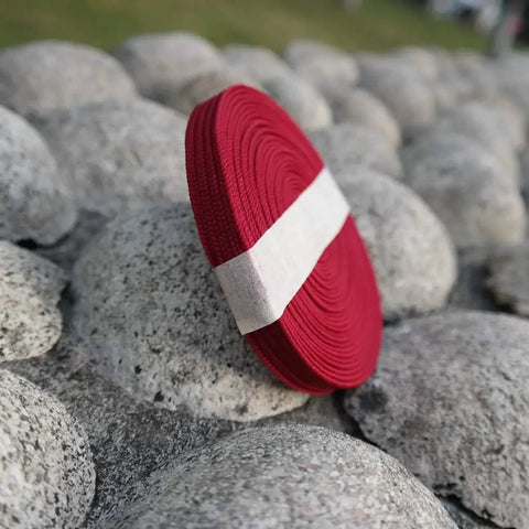 Red Silk Ito Sageo Wrapping Cord Sixteen Point Four Ft for Katana on rocks