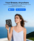 Woman holding Portable 6.5 Inch Desk Fan With 4000mAh Battery And USB Power Cordless Personal Fan by ocean view