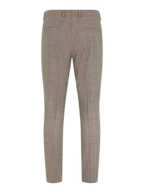 Rear view of men's beige checkered wool trousers with belt loops and back pockets.