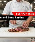Chef slicing steak on pro grade commercial plastic cutting board with large 18 by 12 by half inch thick white poly surface, NSF certified.