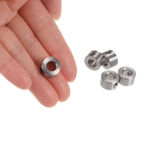 Close-up of stainless steel set-screw shaft collar, 6mm bore; 12mm OD, 7mm wide, 10 pcs shown