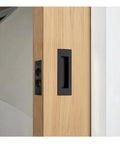 Heavy Duty Pocket Door Handles With Slick Edge Pull Upgrade Your Homestead Setup With Zero Sweat Install Using 304 Stainless Steel Build For Sleek Black Finish And Reliable Operations on wooden door.