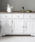 White cabinet with Flower Shaped Cabinet Knobs 8 Pack In Brushed Satin Nickel For Drawers Dressers And Closets, view with decor.