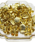 Top Tier 500 Piece Gold Metal Upholstery Tacks For Furniture Reupholstering And Cork Boards in decorative dish close-up.