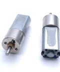 Super Cool 12V DC Gear Motor Tiny Micro Torque Powerhouse For Robot Builds And DIY Projects With Stable Reliable Energy Efficient Performance You Need Today showing two compact metal gear motors.