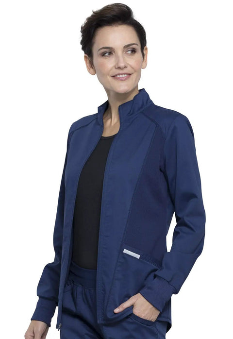 Woman wearing navy Women's Zip Front Scrub Jacket with high low hem, mesh detail, 3 pockets, ultra soft 4 way stretch medical uniform top