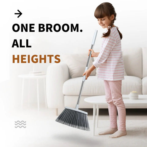 Child holding Adjustable 55 Inch Outdoor Broom For Pet Hair Removal And Heavy Duty Floor Cleaning Indoors And Outdoors
