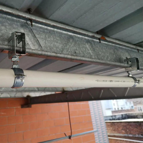 Heavy Duty Conduit Hanger Kit With Beam Clamp And Pipe Support Bracket For I-Beam Install showing secured pipe overhead