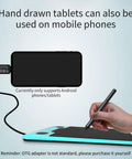 Game Changing Graphics Drawing Tablet With 8192 Pressure Levels And A Dope Battery Free Pen being used with a mobile phone.