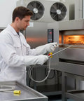 Technician using 2-Pack Type K Thermocouple Probe With Flexible Sensor For High Temperature Measurements Go-To Tool For Serious Heat Minus 40 To 1100 Fahrenheit 0.06 Inch Diameter 40 Inch Cable Plus Minus 0.05 Percent Accuracy Durable Replacement For Industrial Ovens in industrial oven