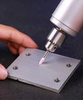 Pro Grade 100 Pcs Abrasive Stone Points Kit for Dremel Rotary Tool in use on metal surface