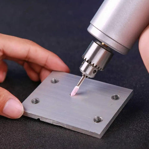 Pro Grade 100 Pcs Abrasive Stone Points Kit for Dremel Rotary Tool in use on metal surface