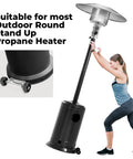 Wheel kit for round stand-up propane outdoor heater; universal movable, black metal base (installed view)