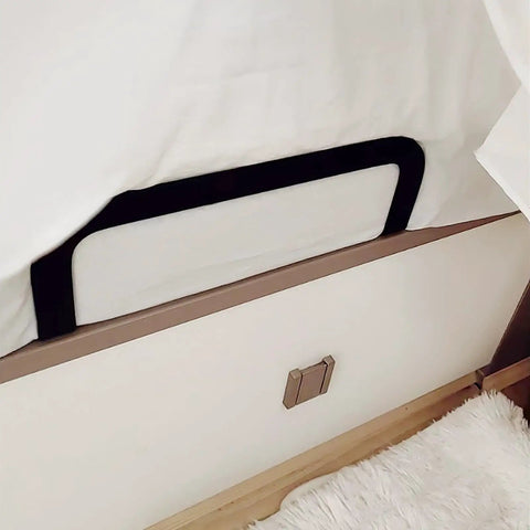 Black metal slide stopper brackets installed under a mattress to prevent shifting, part of Ditch The Daily Slide, Keep Your Mattress Locked Down With These Heavy Duty Retainer Bars, Black Metal Slide Stopper Brackets For Platform And RV Beds, Easy Install Anti Slip Rails That Hold Fast.