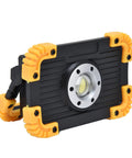 YWBL-WH Mini COB Emergency Flood Light, 6-Angle Adjustable Stand in black with yellow corners, adjustable stand angled for use.