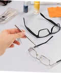 Hand using Two Pack Repair Hook for Eyeglasses and Sunglasses, Compact Portable Eyewear Tool for Quick Adjustments and Fixes on frames.