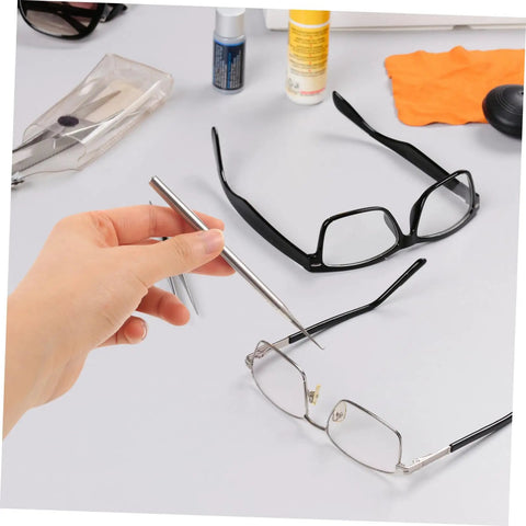 Hand using Two Pack Repair Hook for Eyeglasses and Sunglasses, Compact Portable Eyewear Tool for Quick Adjustments and Fixes on frames.