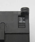 Close-up of Miniature 3-pole contactor B7-30-10-01 with 24V coil, showing voltage marking on compact industrial control relay.