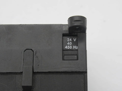 Close-up of Miniature 3-pole contactor B7-30-10-01 with 24V coil, showing voltage marking on compact industrial control relay.