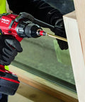 Cordless Hammer Drill Driver SF 6H A22 Bulk For Brick Masonry And Concrete Jobs in use on wooden surface by worker