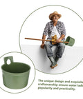 Ergonomic Garden Water Scoops Two Pack For Easy Plant Care, Multi Purpose Water Ladles For Efficient Watering And Fertilizing, Durable Plastic Tools For Home Yard Maintenance, Quick Reach For Pots, Beds, And Raised Planters. Green plastic water scoop shown with long handle