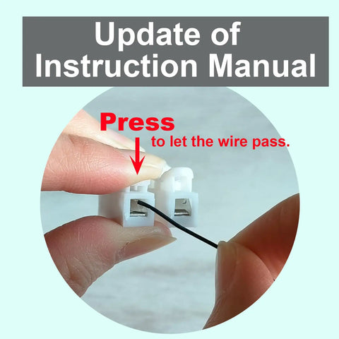 Close-up view of fiber optic light kit instruction manual update showing wire insertion for 12 Kid Friendly Fiber Optic Light Kit Sets.