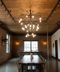Top Shelf Oxidizing Reactive Wood Stain Five Gallon Container used in rustic dining area with wood table and warm lighting.