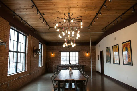 Top Shelf Oxidizing Reactive Wood Stain Five Gallon Container used in rustic dining area with wood table and warm lighting.