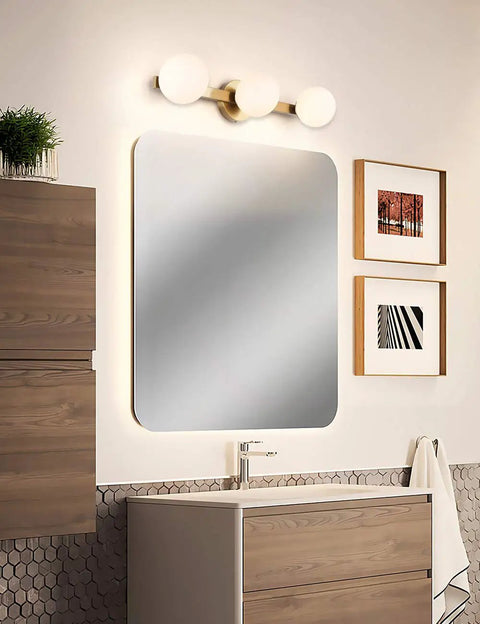 Slick Modern Brass Gold Three Light Vanity Fixture With Milky Glass Shades For Bathroom Over Mirror Wall Sconce